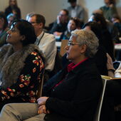 Stefanie Jannedy sits in the audience and listens