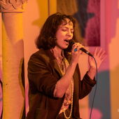 Valeria Dele is singing on stage