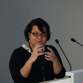 Norma Mendoza-Denton stands at the lectern and speaks