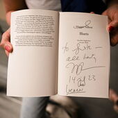 An open copy of Maggie Nelson's book "Bluets" reads the dedication: “To Judith, all best, MN, 14 Jul 23, Berlin”