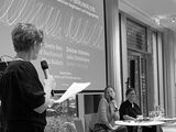 Black-and-white photograph of a podium scene