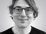 Black and white portrait photo of Falko Schmieder