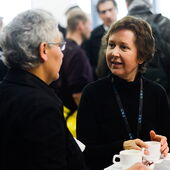 Stefanie Jannedy talks to a visitor