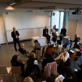 Recording of the audience and the speakers in front from above