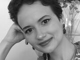 Black and white portrait photo of Paula Magalhães.