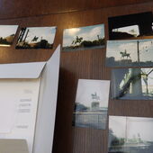 Photographs of a equestrian statue on a wooden wall.