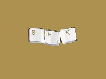 White computer keys forming the word “SHK” (for student assistant) against a golden backdrop.