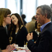 A participant talks with Hagen Findels