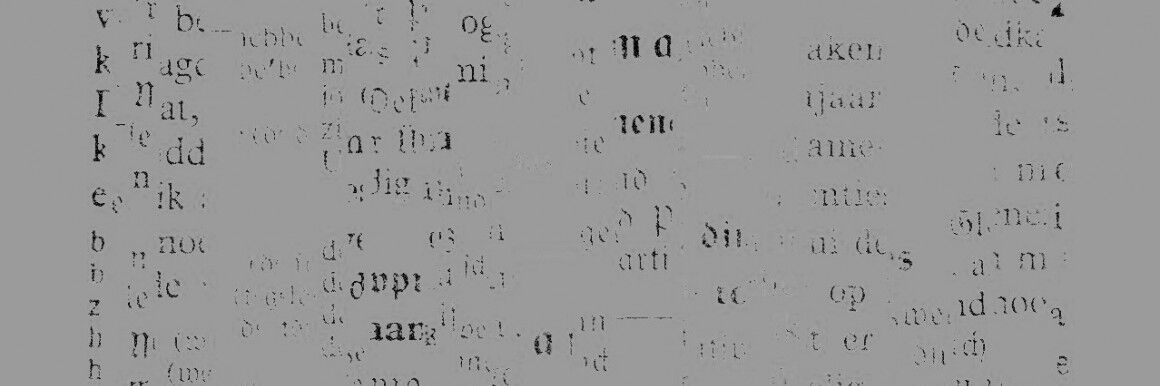 Diverse verschobene, unscharfe Buchstaben auf weißem Papier in chaotischer Anordnung. Die meisten sind kaum zu erkennen.