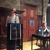Lara Körte and Christina Pareigis in front at podium and reading table