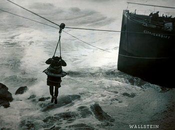 Photograph of a sea rescue scene on a stormy sea.