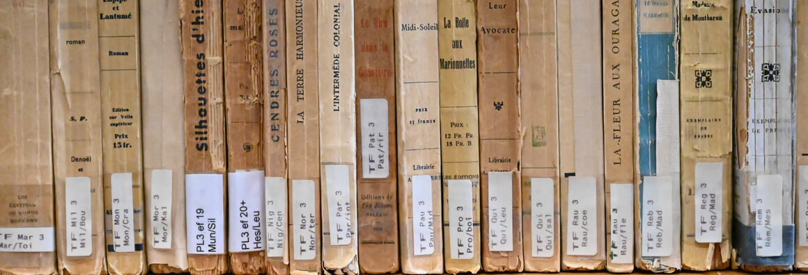 Back cover of old French books with library signatures.